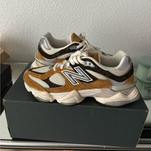 New Balance 9060 in vibrant yellow/cognac color.